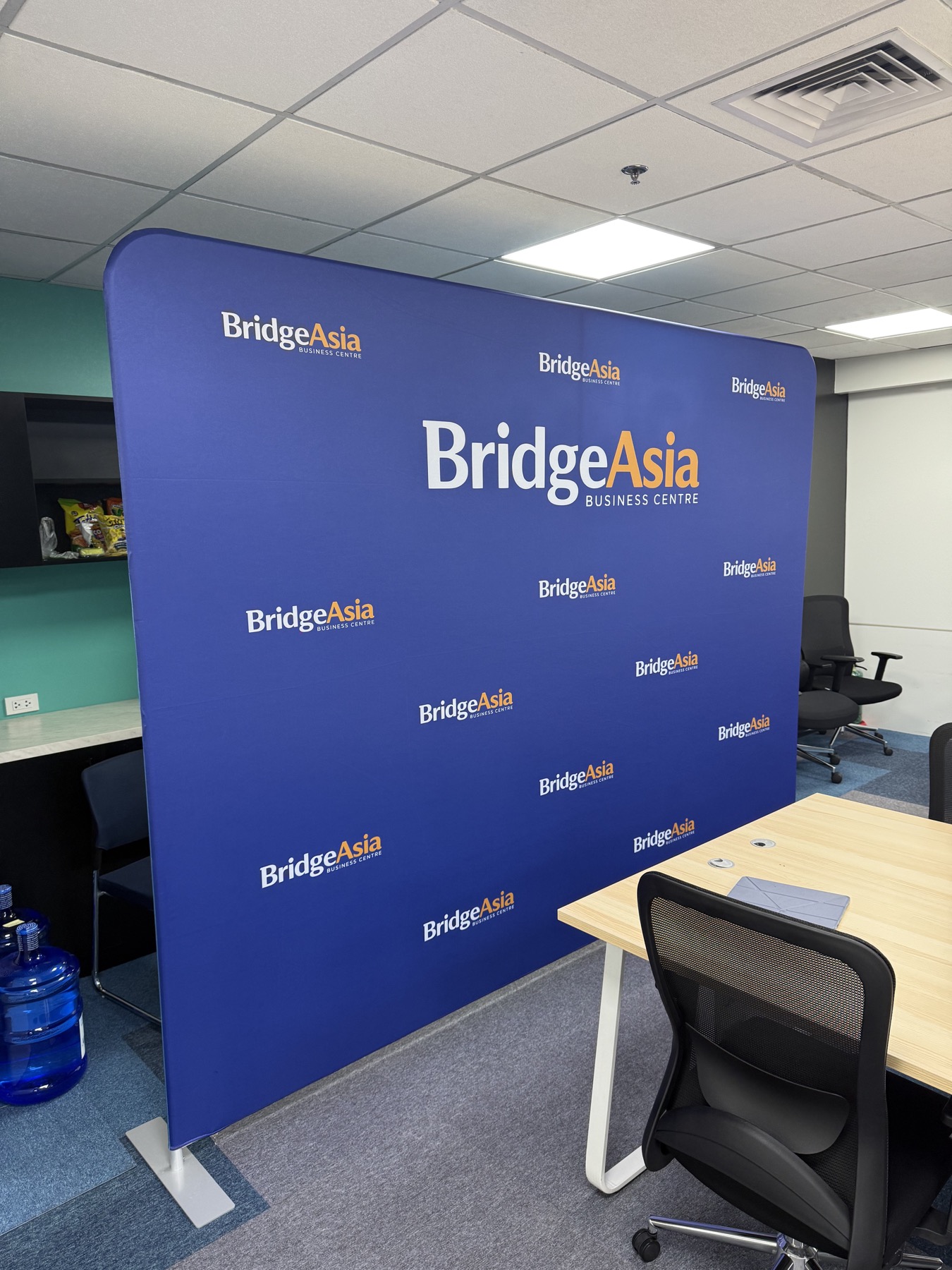 BridgeAsia backdrop installed in an office